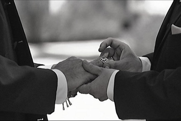 Gay men exchange rings