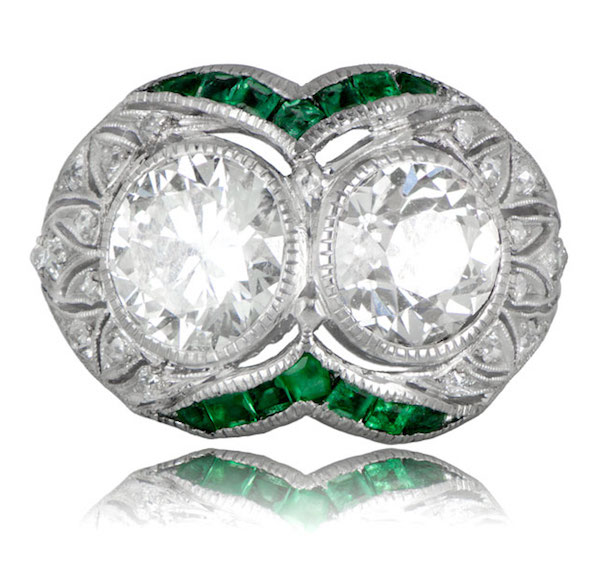 Art Deco engagement ring with two old European-cut diamonds (1.60ct and 1.70ct) with emeralds in platinum with filigree and milgrain (EstateDiamondJewelry.com)