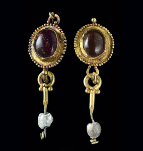 Roman earrings, c. 1st century A.D., of garnet bezel-set in gold with granulation and suspended with pearl and glass beads (est. $3,000-5,000, Christie's NY, Dec. 10, 2013)