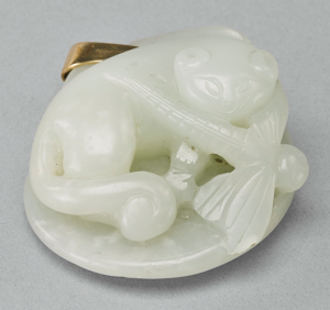 Jade carving of cat with dragonfly